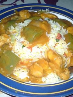 A picture of Chicken shashlik with fried rice.