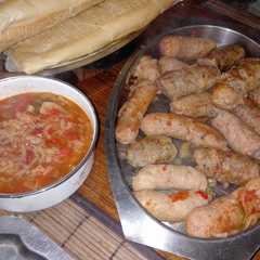 A picture of Chorizos a la pomarola.