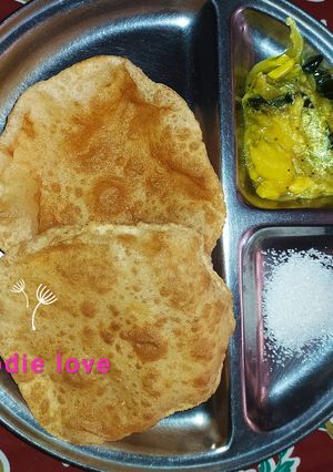A picture of Wheat and mixed millet poori with Potato curry.