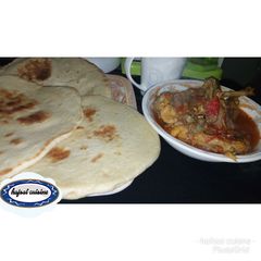 A picture of Chapatti with chicken papar soup.