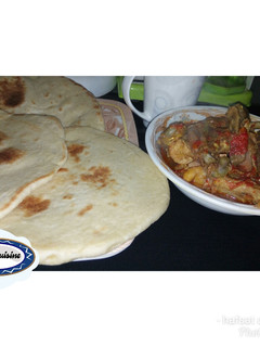 A picture of Chapatti with chicken papar soup.