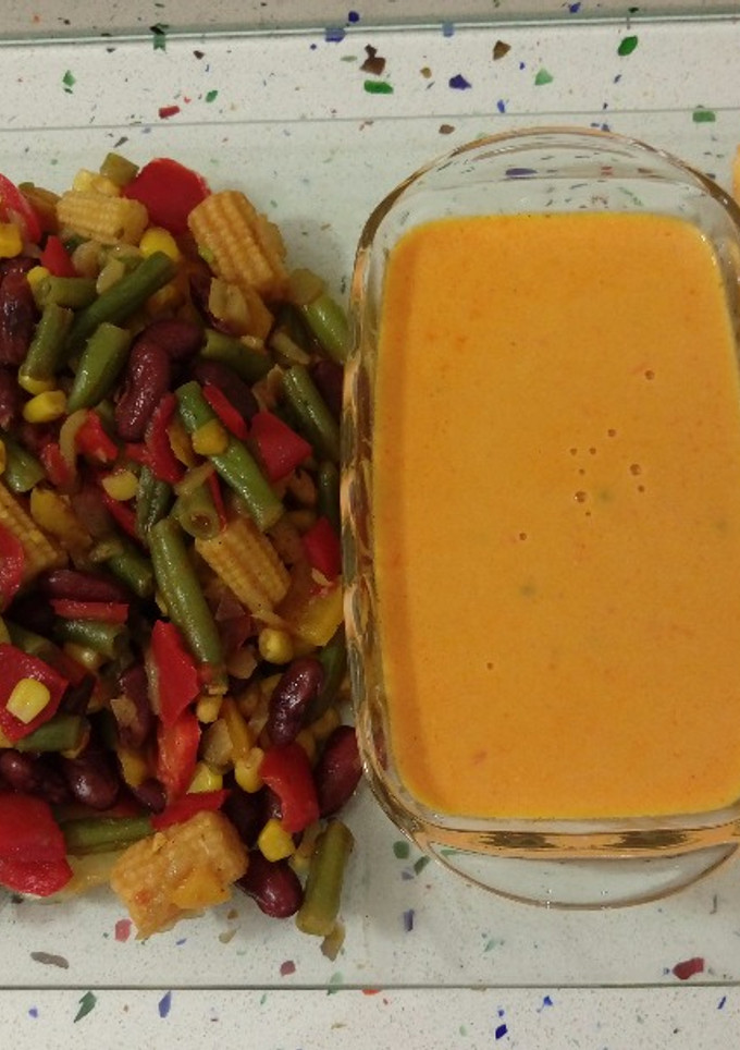 Una foto de Suprema de merluza en salsa y salteado mexicano