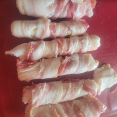 A picture of Bacon-wrapped Mozzarella Sticks.