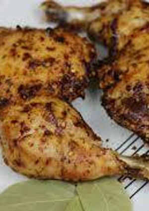 A picture of This is grilled chicken with frying pan without oven.