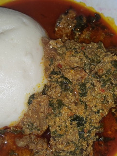 A picture of Semo and egusi soup.
