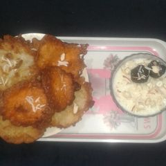 A picture of Malpua with Kheer and Chhena Gulab Jamun.