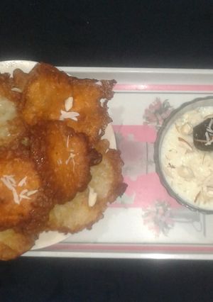 A picture of Malpua with Kheer and Chhena Gulab Jamun.