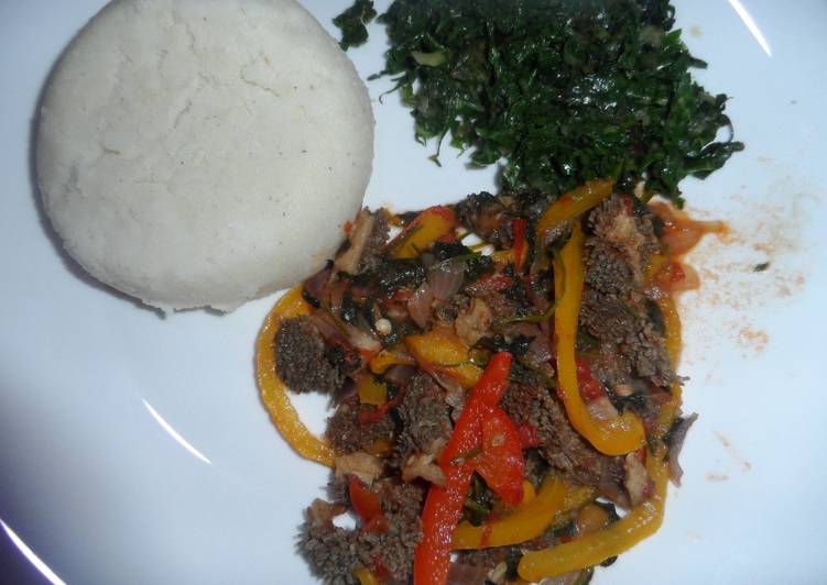 Matumbo (tripes) served with ugali and spinach