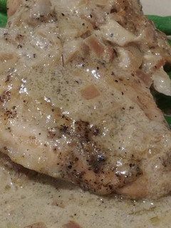 A picture of Chicken in a White Wine Sauce.