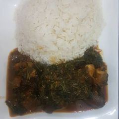 A picture of Vegetable soup with rice.