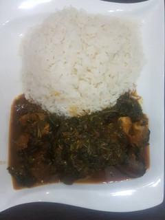 A picture of Vegetable soup with rice.