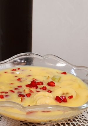 A picture of Vanilla custard with fruits.