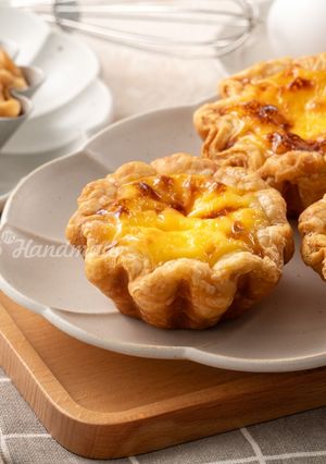 A picture of Mini Flower-Shaped Portuguese Egg Tarts with Puff Pastry.
