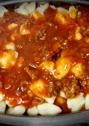 Una foto de Ñoquis livianos con bolognesa