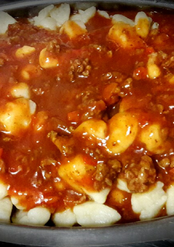 Una foto de Ñoquis livianos con bolognesa