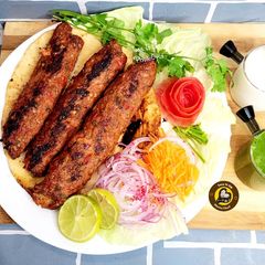 A picture of Turkish Chicken Adana Kabaabs In Oven And On Skillet.
