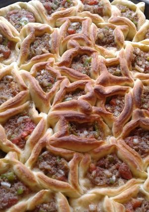 A picture of Meat-Stuffed Honeycomb Bread (Lahmeh bil Ajeen).