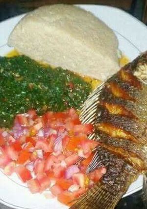 A picture of Fried Fish, Kales and Kachumbari With Ugali.