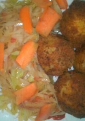 A picture of Potato fritters and fried cabbage.