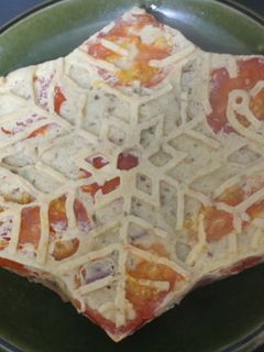 Una foto de Estrella de pan duro con jamón asado