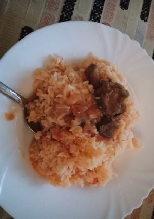 A picture of Fried Rice with Beef Stew.