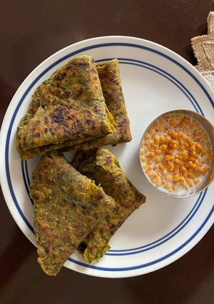 A picture of Palak paratha with Boondi Raita.