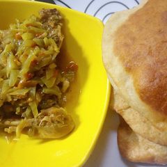 A picture of Fateerah with chicken sauce.
