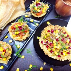 A picture of Corn chat in potato basket.