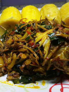 A picture of Boiled plantain with ugba sauce and smokedfish.