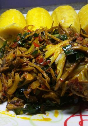 A picture of Boiled plantain with ugba sauce and smokedfish.