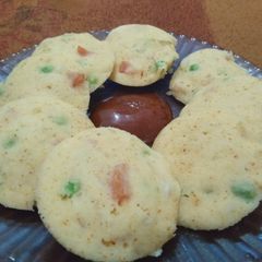 A picture of Vegetable Idli with Sauce.