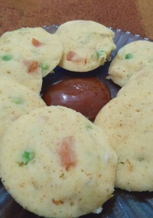 A picture of Vegetable Idli with Sauce.