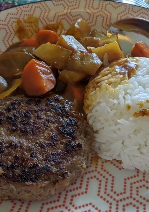 A picture of Japanese curry with beef patty.
