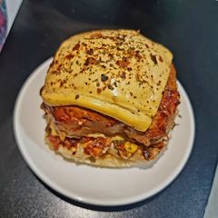 A picture of Domino's style veg premium burger pizza.