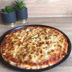 Una foto de Pizza de pollo