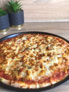 Una foto de Pizza de pollo