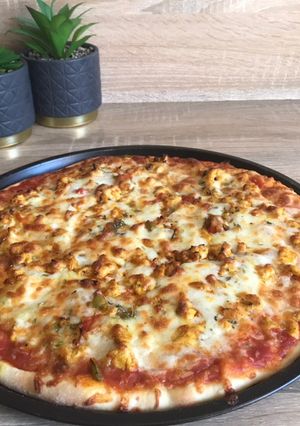 Una foto de Pizza de pollo