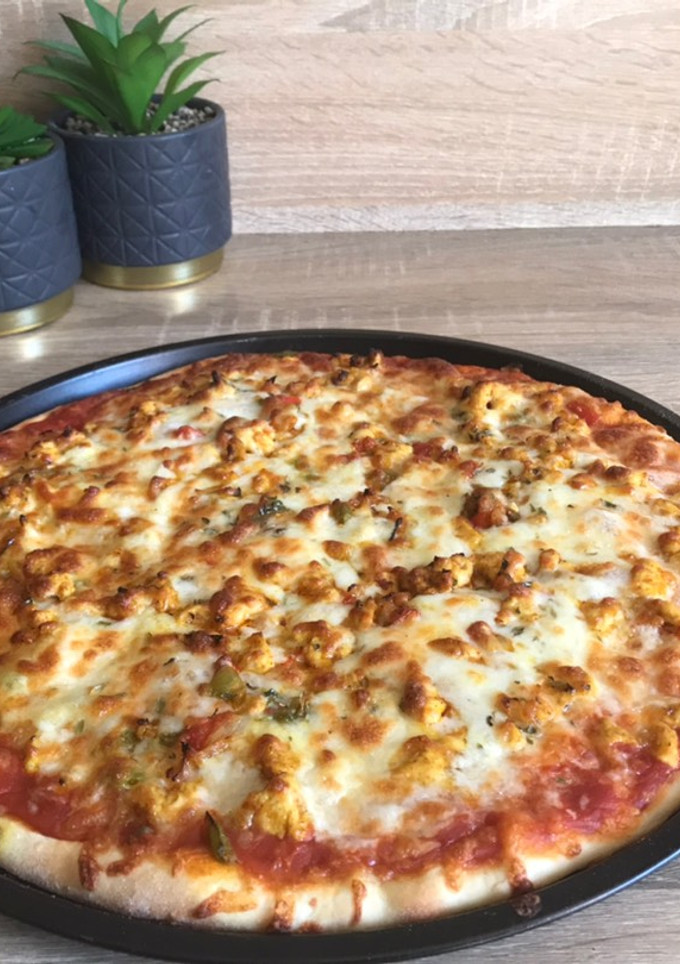 Una foto de Pizza de pollo