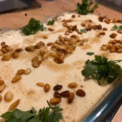 A picture of Kafta with Tahini (meat with sesame paste).