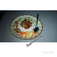 A picture of White rice with miyan jajjage $ potato salad with lil cab.&lett.