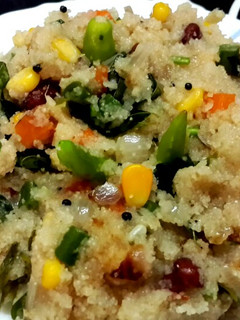 A picture of Rava Upma with corn and vegetables.