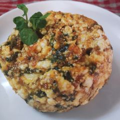 A picture of Crumbled cottage cheese in peanut butter sauce.