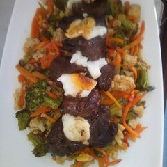 A picture of Fillet of steak with stir fried veggies.
