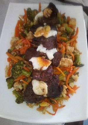 A picture of Fillet of steak with stir fried veggies.