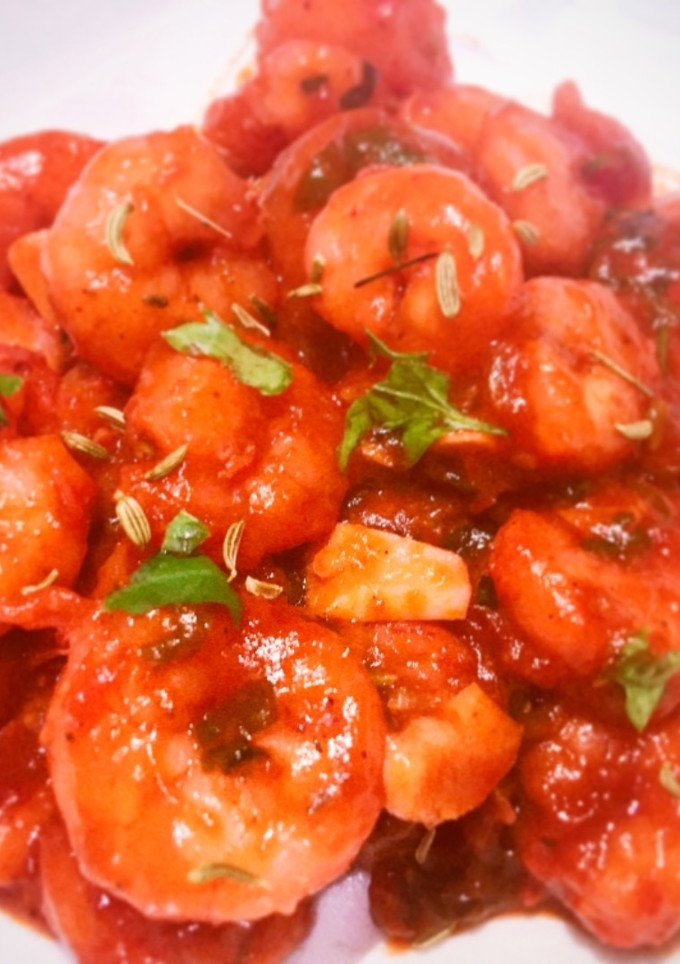 Una foto de Gambitas en salsa tandoori de tomate