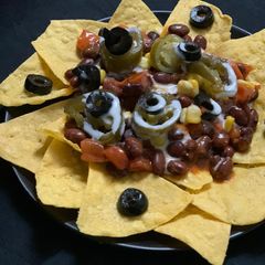 A picture of Nachos with Spicy beans.