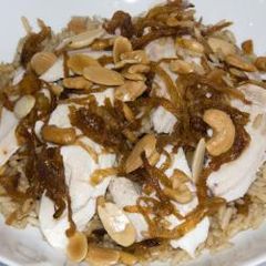 A picture of Fried fish and brown-colored rice - siyyadieh.