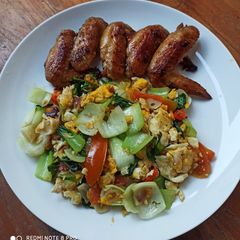 A picture of Pan Fried Chicken Wings and Stir Fry Bok Choi with Scrambled Eggs.