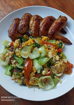 A picture of Pan Fried Chicken Wings and Stir Fry Bok Choi with Scrambled Eggs.