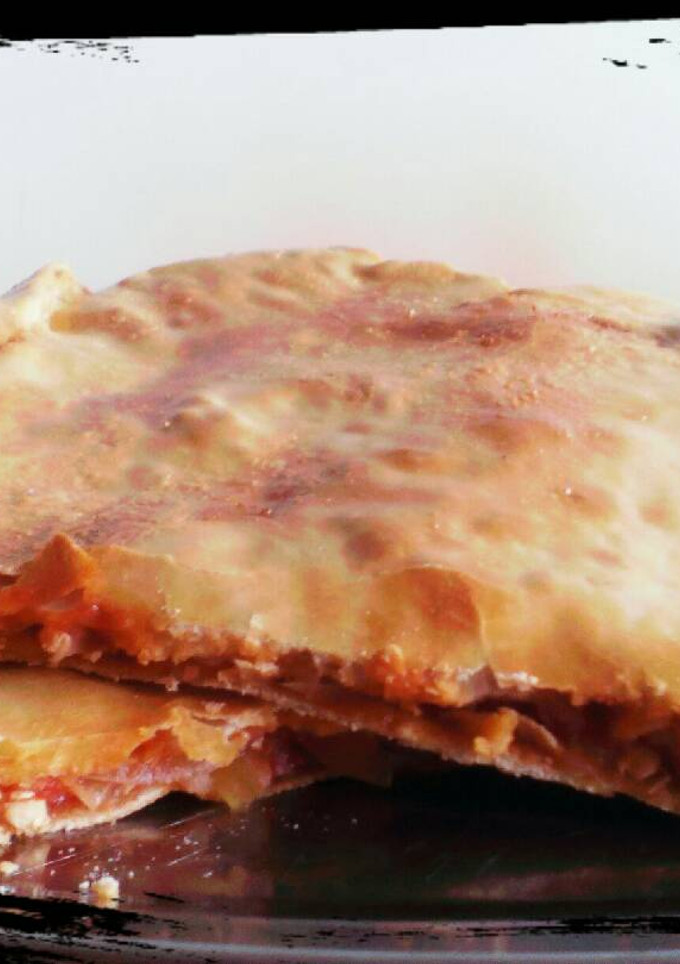Una foto de Empanada de pollo con tomate
